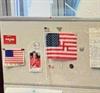 The bulletin board behind his desk in Washington, D.C.