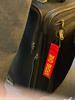 Keith liked this guy's luggage tag and took a pic of it